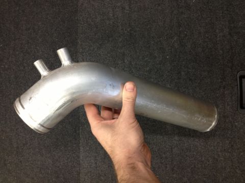 1998 Ford Crown Victoria - Custom aluminum intake pipe with dual spouts, held for inspection.