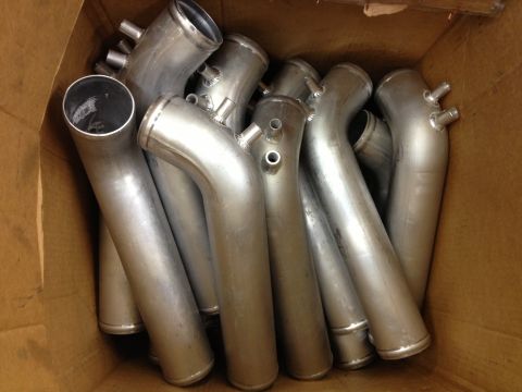 1998 Ford Crown Victoria - A collection of aluminum intake pipes are shown inside a cardboard box.