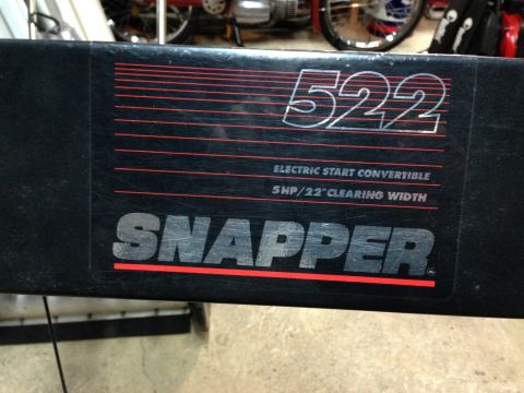 1999 Tomos Targa - Close-up of a Snapper 522 lawnmower deck, showing its model number and specifications.
