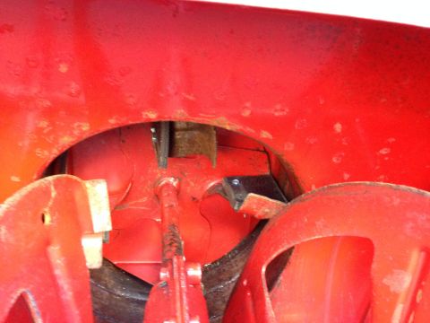 1999 Tomos Targa - The internal workings of a red snow blower's auger are visible in this close-up shot.