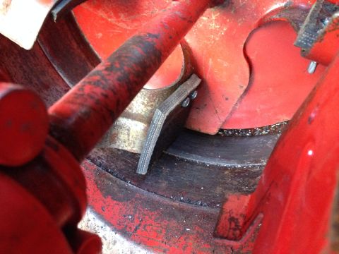 1999 Tomos Targa - Close-up of a red engine component with a visible belt and fasteners, showing signs of use.