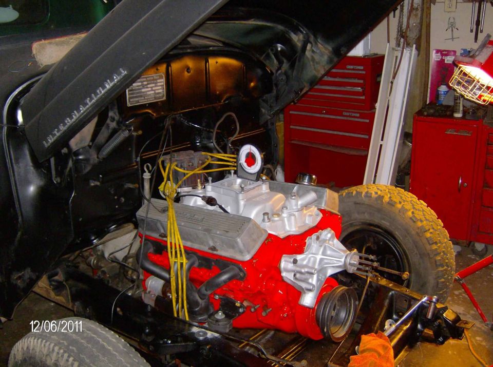 Engine bay with a red engine and "INTERNATIONAL" on the hood