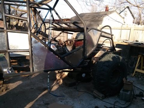 1986 Ford Bronco - This custom-built buggy is in a state of construction, a roll cage and large off-road tires.