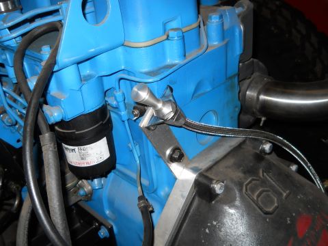 1992 Ford Bronco - Engine component detail showing a blue block, filter, and braided hose.