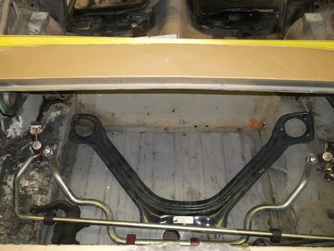1967 Ford Mustang - Close-up of car's undercarriage, focusing on suspension parts and chassis. SuperMotors.net logo is present.