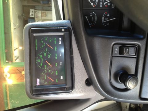 1997 Ford F-350 - Interior view of a digital gauge display and dashboard controls, including a fuel switch and light knob.