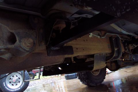 1996 Ford Bronco - Rear mount under body mount bracket. Ford put about a 2" hole there so I used a backing plate to clamp the frame. There's also a hole behin…