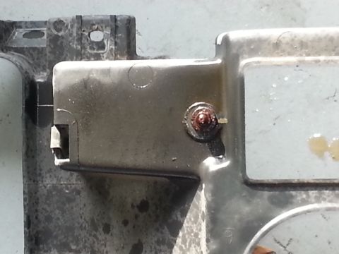 1994 Ford Bronco - This image shows a close-up of an automotive part, not a 1994 Ford Bronco headlight.