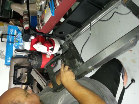 1994 Ford Bronco - Tools are visible inside the car's interior, obscuring the dashboard details.