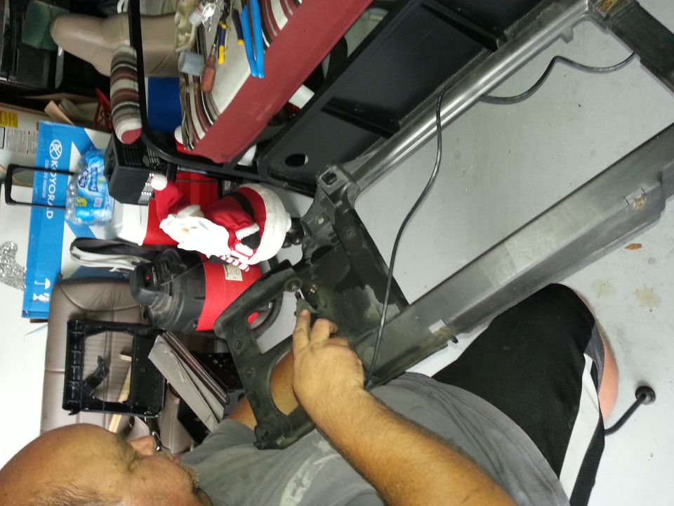 Close-up of car interior showing red and blue tools on the dashboard