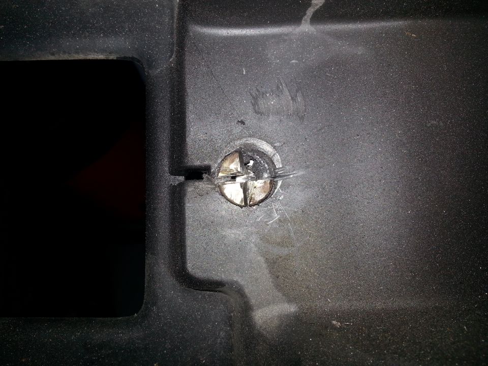 Screw in black plastic trim with Supermotors.net logo