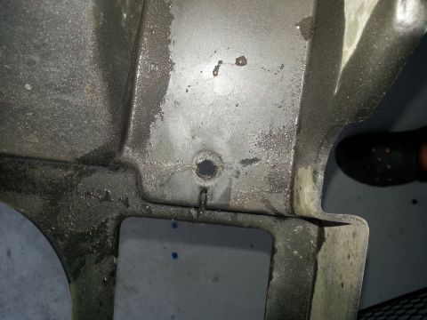 1994 Ford Bronco - A close-up view of a vehicle component, showing a hole and some fluid residue. The Supermotors.net watermark is present.