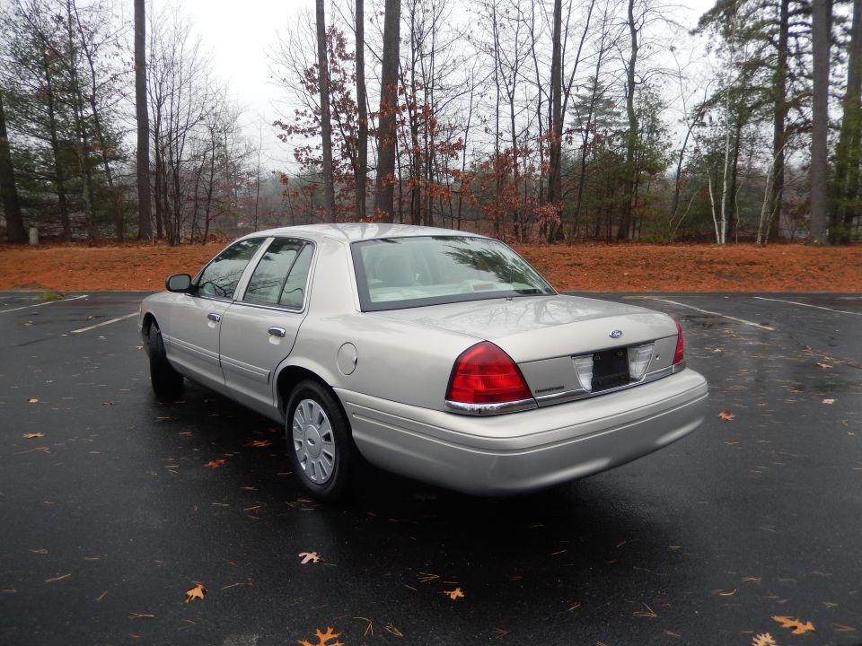 Silver 2001 Ford Crown Victoria, rear 3/4 view