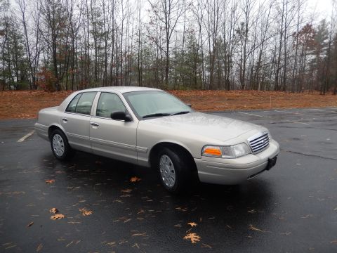2001 Ford Crown Victoria - Silver 2001 Ford Crown Victoria sedan parked outdoors on a cloudy day.