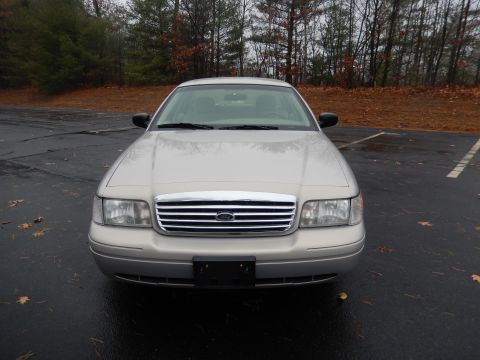 2001 Ford Crown Victoria - Silver 2001 Ford Crown Victoria parked in a lot with trees in the background.
