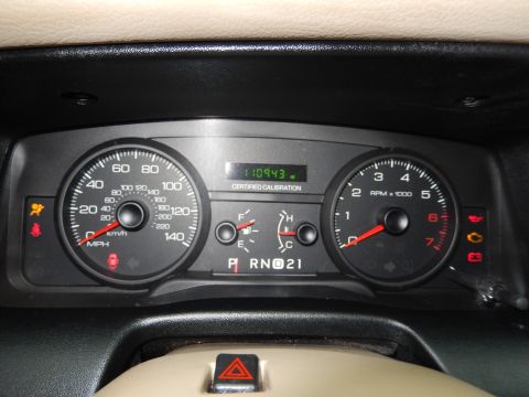2001 Ford Crown Victoria - The vehicle's interior dashboard displays the speedometer, tachometer, and odometer reading.