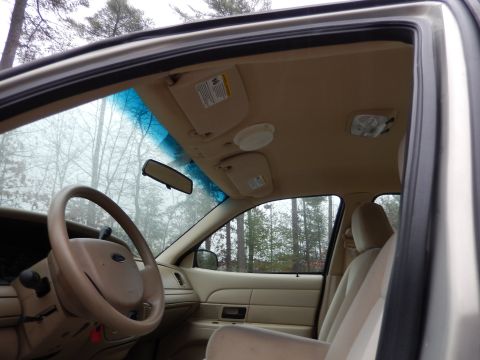 2001 Ford Crown Victoria - Interior view of a 2001 Ford Crown Victoria, showing the driver's side dashboard and passenger seat.