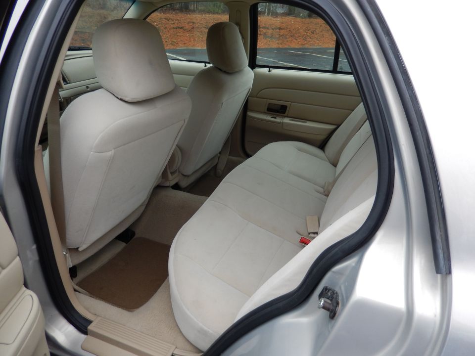 Interior view of a car's back seat and door frame