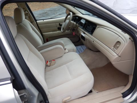 2001 Ford Crown Victoria - Interior view of a 2001 Ford Crown Victoria, showing the front seats and dashboard.