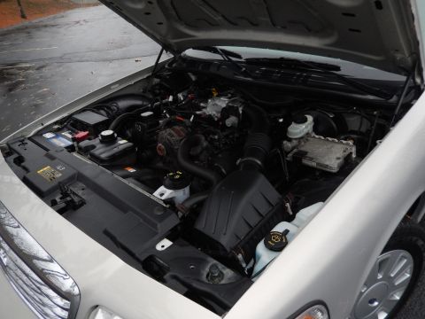 2001 Ford Crown Victoria - Engine bay of a 2001 Ford Crown Victoria, viewed from the front passenger side with the hood raised.