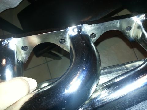 1994 Ford Bronco - Close-up of a chrome exhaust manifold, likely an aftermarket part.