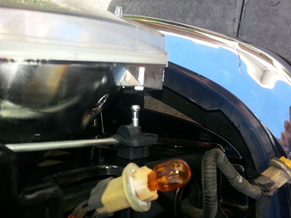 Headlight assembly with amber bulb and chrome trim