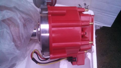 1979 Ford Bronco - A red ignition distributor with electrical wires is shown, likely a replacement part.