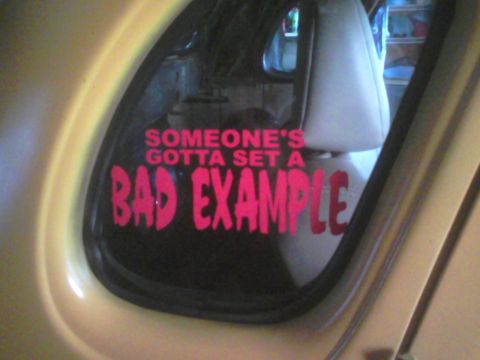 1935 Chevrolet New - A car window displays a pink decal with the phrase "SOMEONE'S GOTTA SET A BAD EXAMPLE".