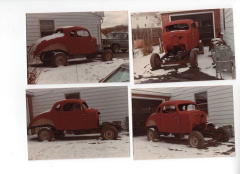 1935 Chevrolet New - This red coupe body, stripped down and missing its front end, is parked outside in the snow.