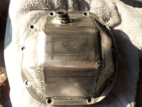 1994 Jeep Cherokee - This is a polished metal differential cover with visible welds and bolt holes.