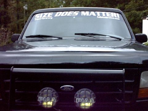 1995 Ford Bronco - This black 1995 Ford Bronco features a prominent windshield banner and auxiliary lighting on its bull bar.