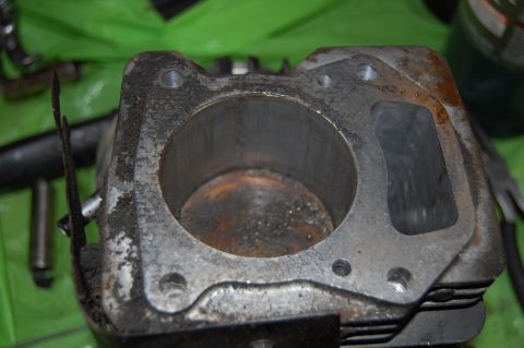 2006 Honda RANCHER - This is a close-up view of a worn engine cylinder block, showing internal carbon deposits.
