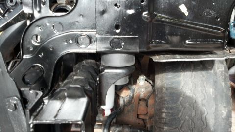 1993 Ford Bronco - Vehicle frame and suspension components are visible in this close-up shot.