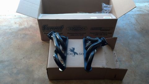 1993 Ford Bronco - New exhaust headers are shown in their packaging, with the Summit Racing logo visible on the boxes.