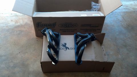 1993 Ford Bronco - New exhaust headers are shown in their packaging, ready for installation.