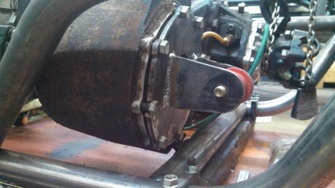 1982 Ford F-100 - Transfer case and exhaust pipe assembly, likely part of a custom build or repair.