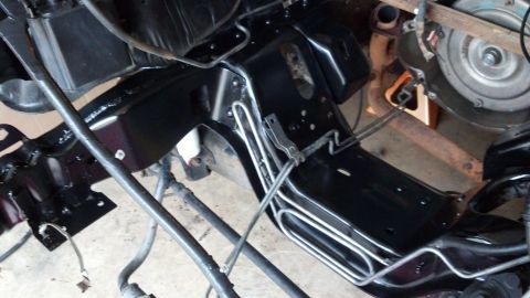 1993 Ford Bronco - Vehicle frame and transmission components are visible in this close-up shot.