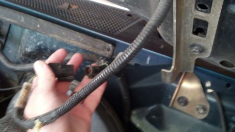 1993 Ford Bronco - Disconnecting an electrical connector in the engine bay.
