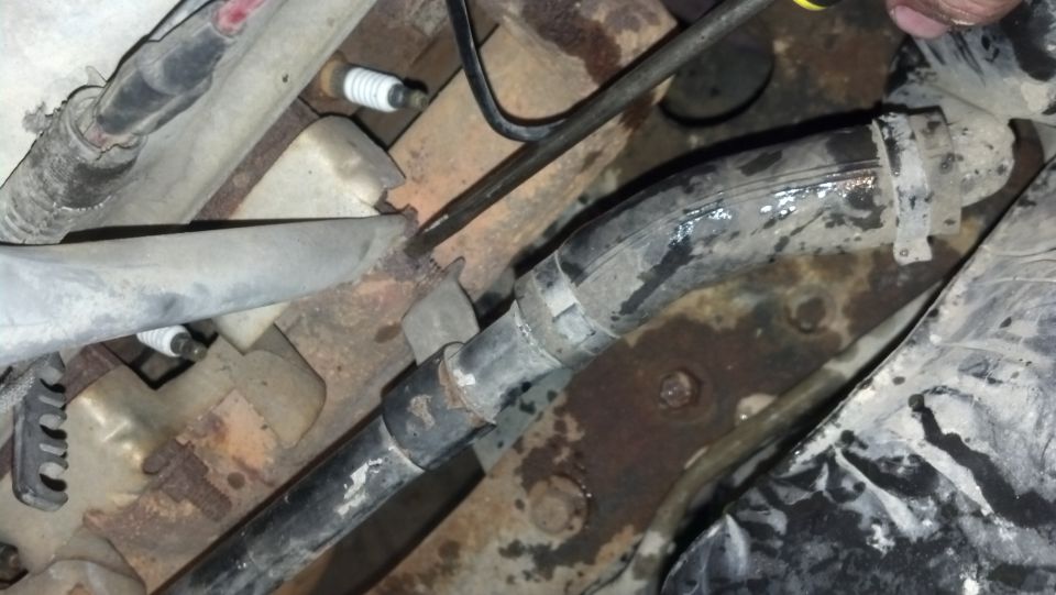 close-up of engine hoses and spark plugs