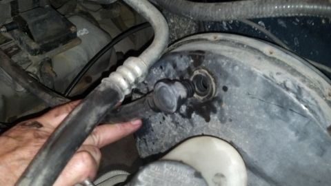 1993 Ford Bronco - Brake booster and vacuum line detail, likely from an older vehicle's engine bay.