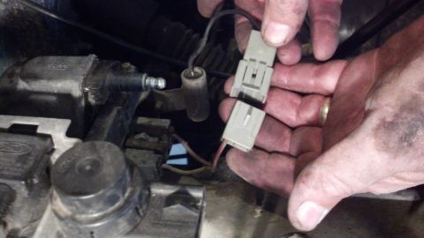 1993 Ford Bronco - Connecting electrical connectors in the engine bay of a 1993 Ford Bronco.