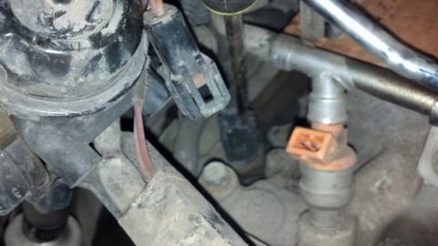 1993 Ford Bronco - This image shows a close-up view of a fuel injector, part of a vehicle's engine system.