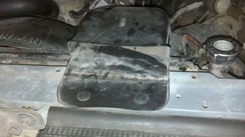 1993 Ford Bronco - A close-up view of an engine bay component, with partial text reading 'FAN' visible on a shroud.