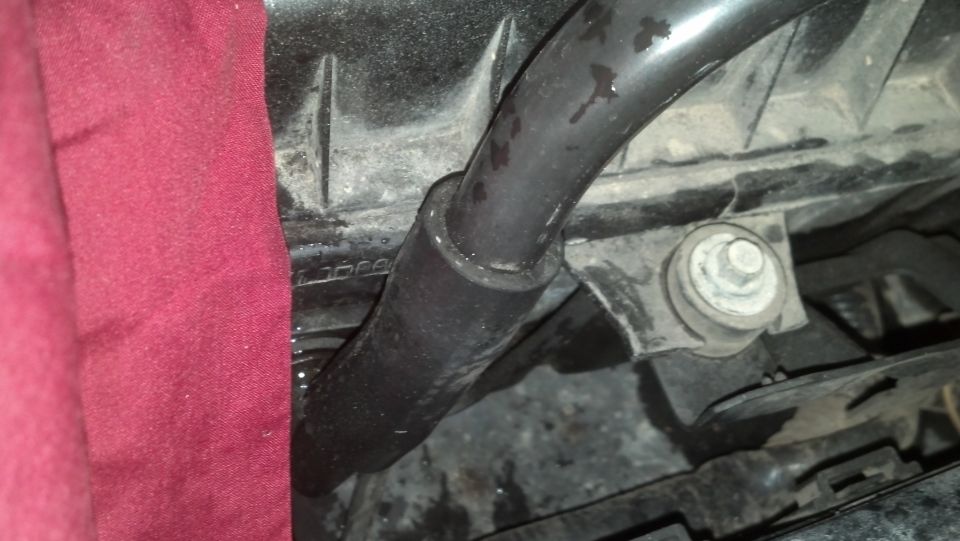 Engine hose and mounting bracket with red cloth