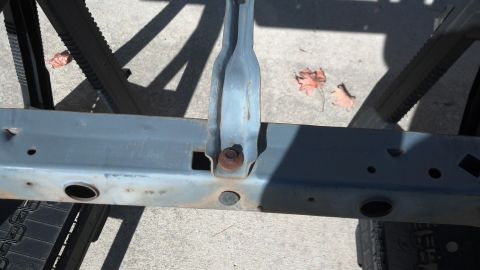 1993 Ford Bronco - Close-up of a vehicle's frame, showing structural components and signs of wear.