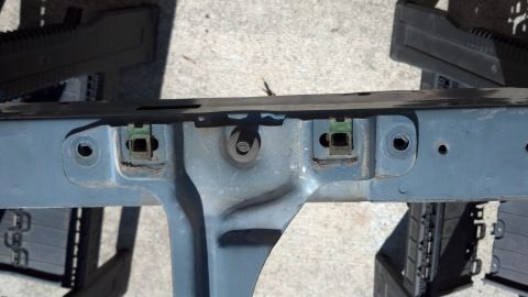 1993 Ford Bronco - A close-up view of a vehicle's structural component, possibly part of the chassis or subframe.