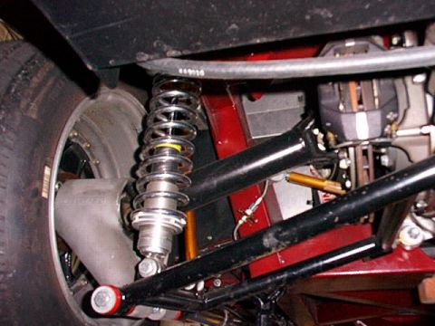 1967 Ford 427 - This photo shows the rear suspension assembly of a vehicle, including a shock absorber and axle components.