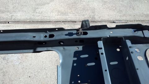 1993 Ford Bronco - Close-up view of a vehicle's frame rail section, showing structural components and mounting points.
