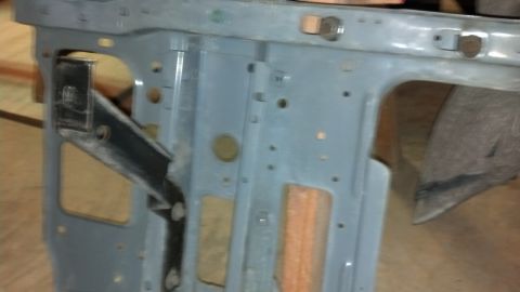 1993 Ford Bronco - Close-up of a vehicle frame section, likely from the front end, showing structural components.