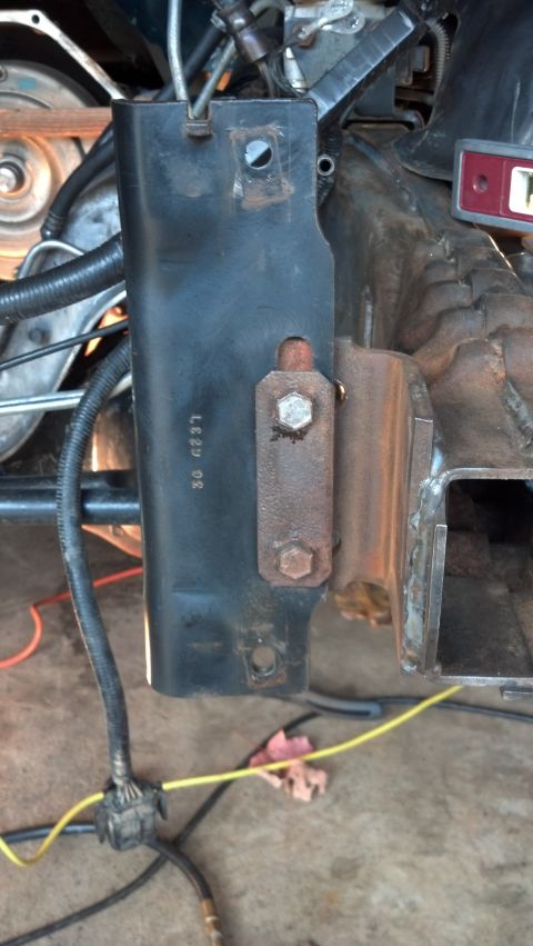 1993 Ford Bronco - Close-up of a black metal bracket with stamped numbers '30 6237' visible in an engine bay.